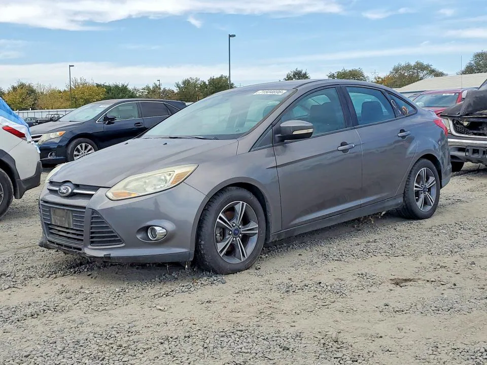 2014 Ford Focus VIN 1FADP3F29EL341464 фото 1