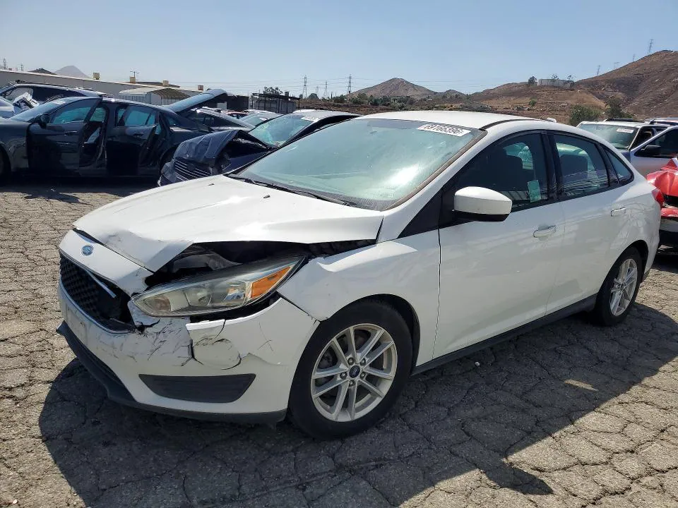 2018 Ford Focus VIN 1FADP3F24JL293382 фото 1
