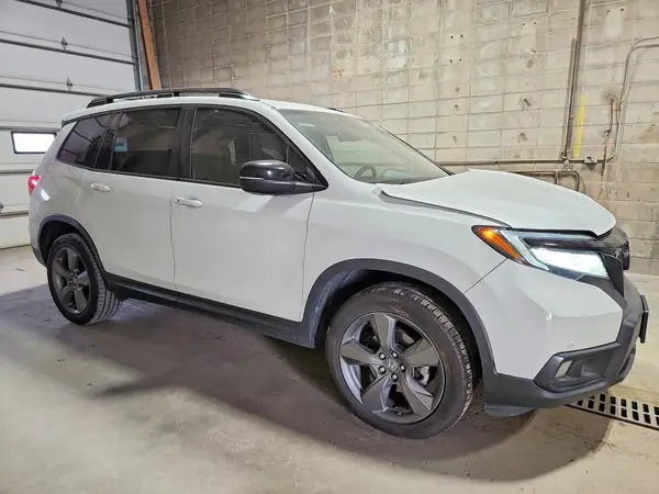 5FNYF8H97MB026749 — 2021 Honda Passport, фото 4 с аукциона Copart, Передняя часть