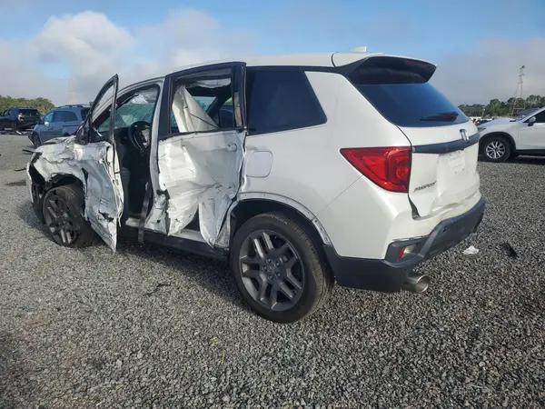 5FNYF8H59PB002759 — 2023 Honda Passport, фото 2 с аукциона Copart, Боковая часть