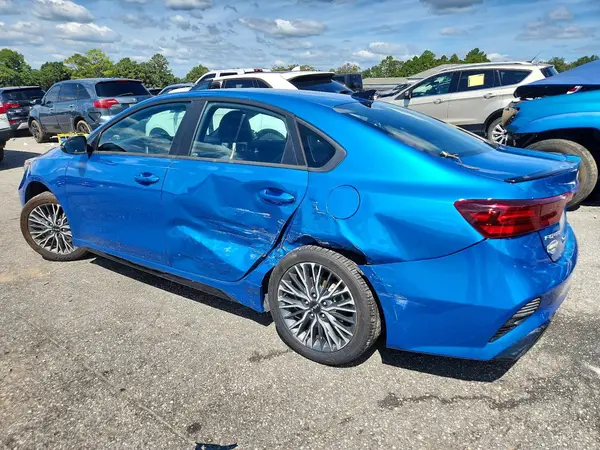 3KPF54ADXPE658074 — 2023 Kia Forte, фото 2 с аукциона Copart, Боковая часть