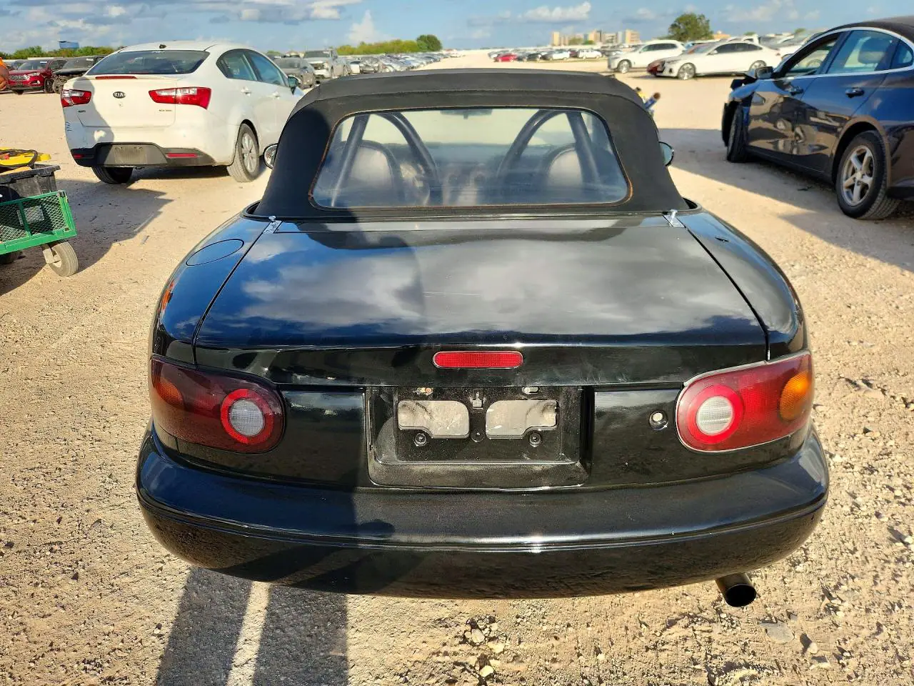JM1NA3532V0736694 — 1997 Mazda MX-5, фото 6 с аукциона Copart, Сторона
