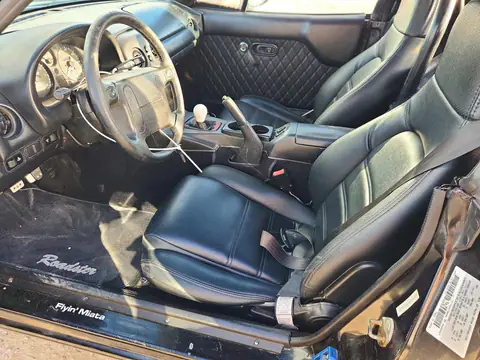 JM1NA3532V0736694 — 1997 Mazda MX-5, фото 7 с аукциона Copart, Сторона