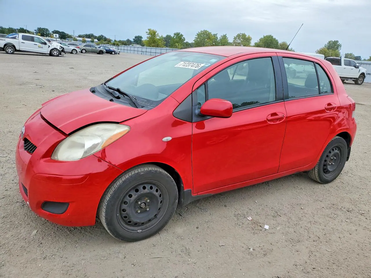 2009 Toyota Yaris VIN JTDKT923995256116 фото 1