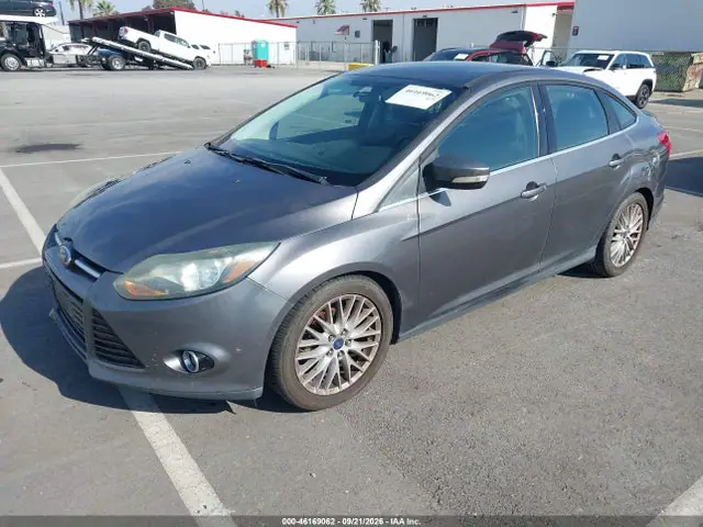2014 Ford Focus Titanium VIN 1FADP3J20EL382573 фото 2