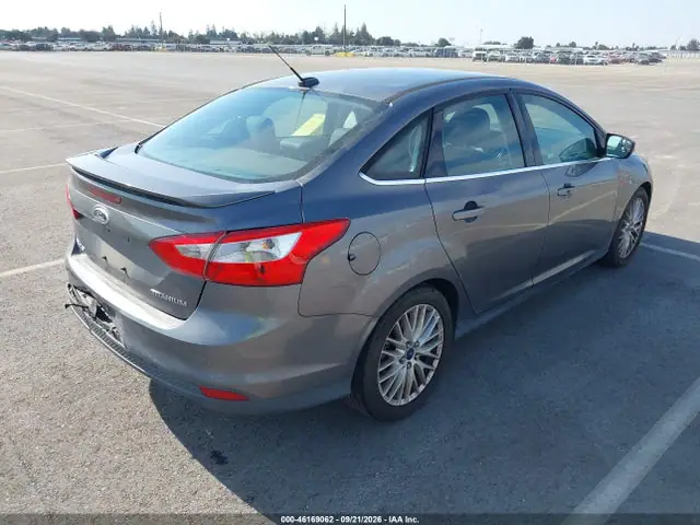 2014 Ford Focus Titanium VIN 1FADP3J20EL382573 фото 4