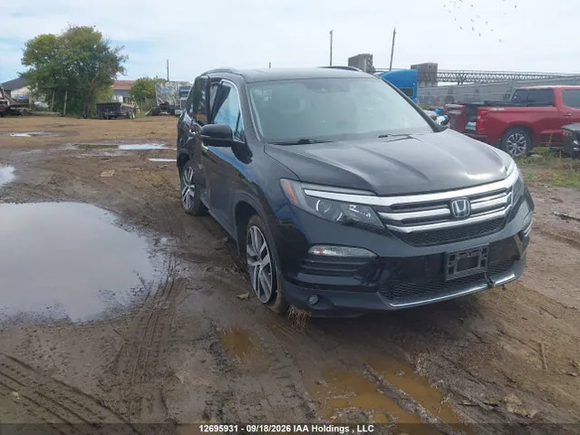 2018 Honda Pilot Touring VIN 5FNYF6H90JB504445 фото 1