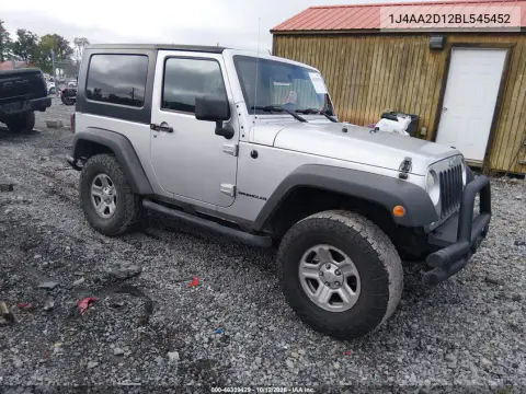 1J4AA2D12BL545452 — 2011 Jeep Wrangler, Сзади слева, фото до ремонта