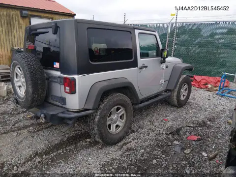1J4AA2D12BL545452 — 2011 Jeep Wrangler, Сзади слева, фото до ремонта