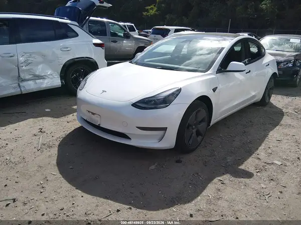 5YJ3E1EA3PF504172 — 2023 Tesla Model 3, фото 2 с аукциона IAAI, Задняя часть слева