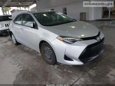 5YFBURHE3HP691074 — 2017 Toyota Corolla, Сзади слева, фото до ремонта