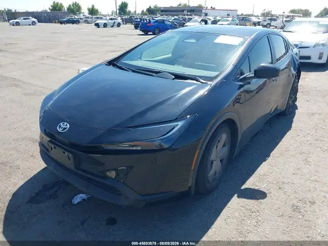 JTDACAAU3R3030124 — 2024 Toyota Prius LE, фото 2 с аукциона IAAI 14.10.2026, Задняя часть слева