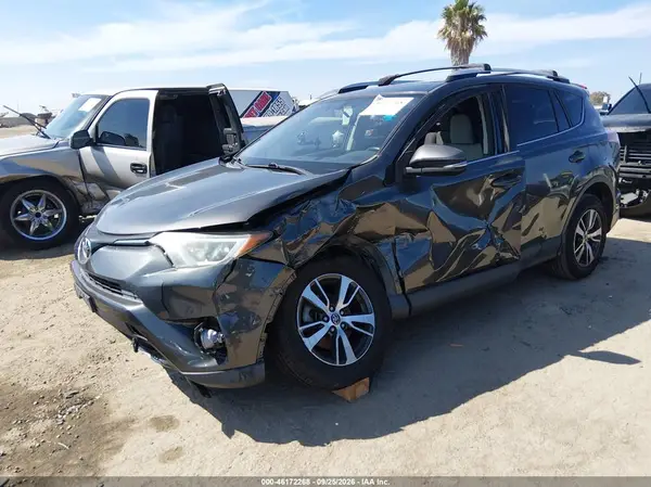 JTMWFREV7GJ081973 — 2016 Toyota RAV4, фото 2 с аукциона IAAI, Левый бок